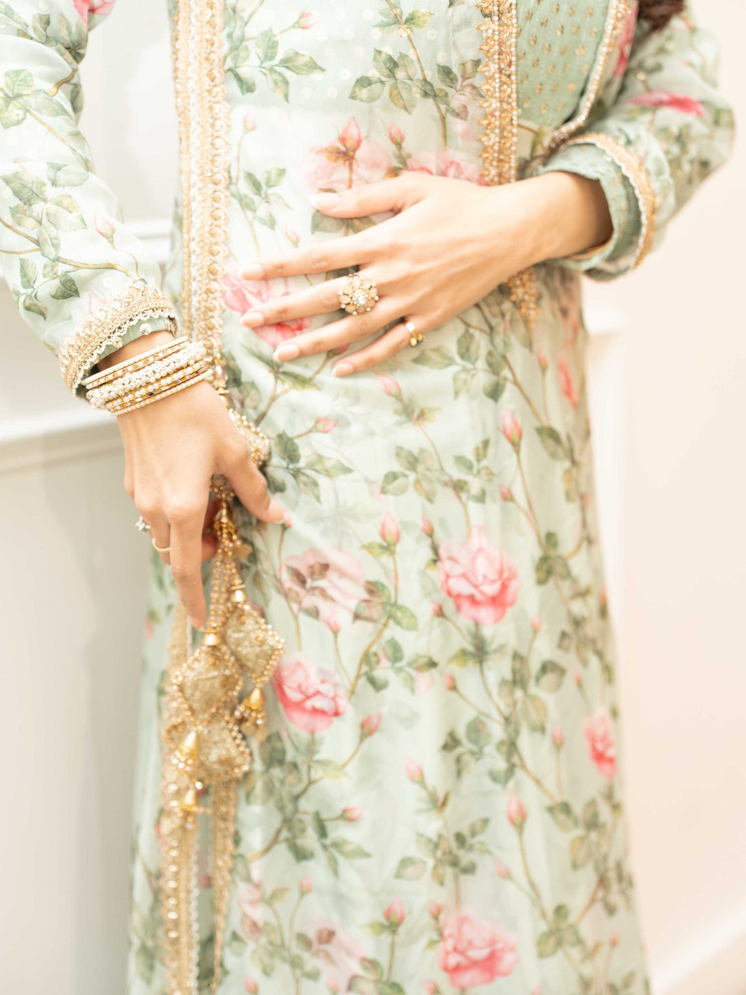 Gulab — layered floral silk outfit with gold zardozi neckline detail, close up