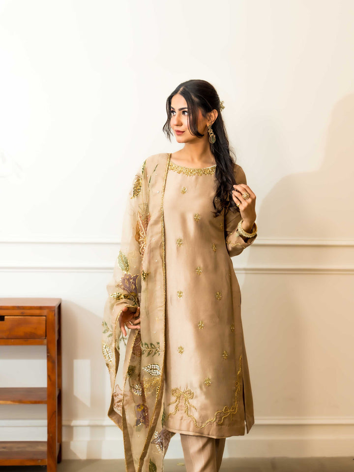 Faryal — beige raw silk kameez and matching trousers with hand-painted floral organza dupatta, 3/4 view