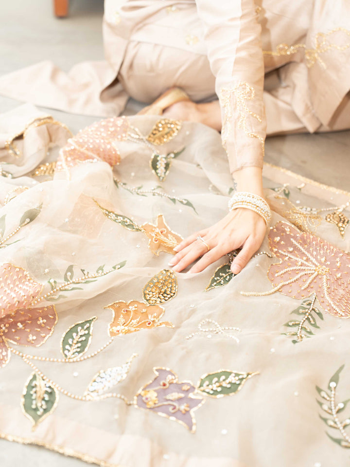 Faryal — beige raw silk kameez with floral organza dupatta draped over shoulder, full length view